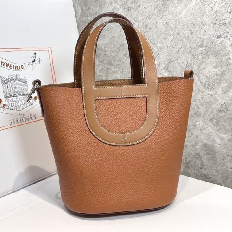 H**mes shopping bags